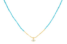 Turquoise and gold beaded necklace with evil eye pendant