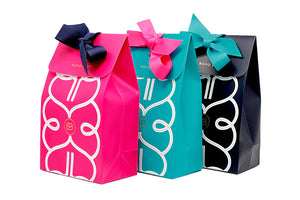 Cerese, turquoise and navy blue gift boxes with tie ribbon