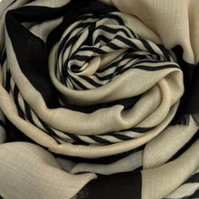 Cream and black maze monogram scarf rolled up